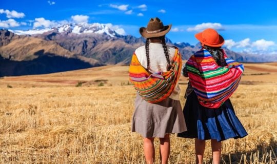 the-sacred-valley-of-the-incas-with-two-native-women-looking-at-view
