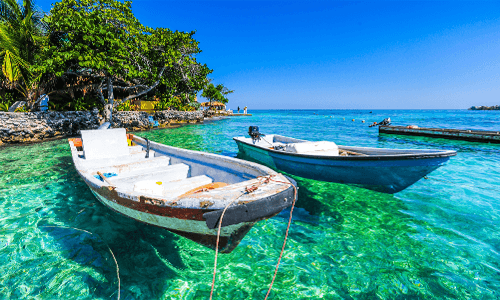 Two boats in crystal blue water in Colombia