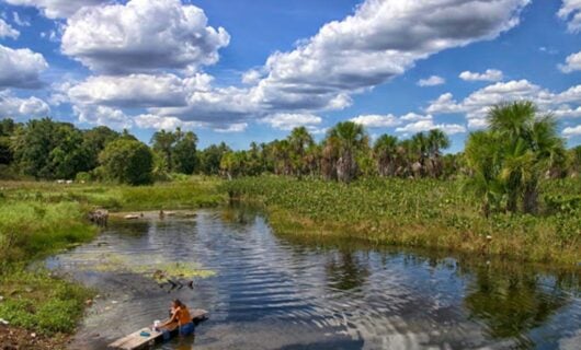 woman standing in lagoon water