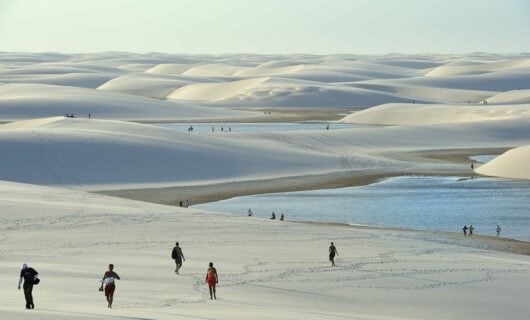 People exploring Lençóis Maranhenses