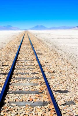 Train track across salt flats of Bolivia