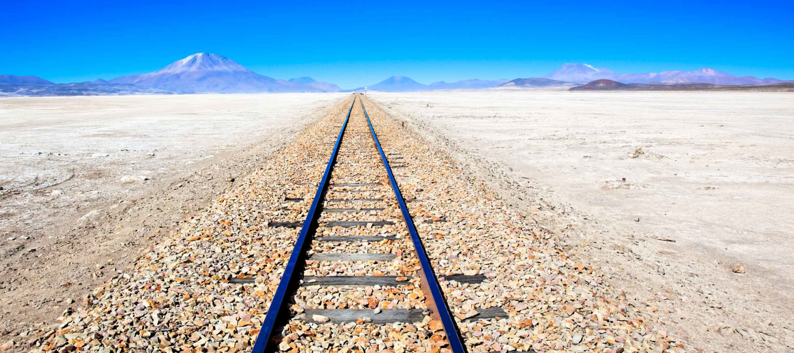 Train track across salt flats of Bolivia