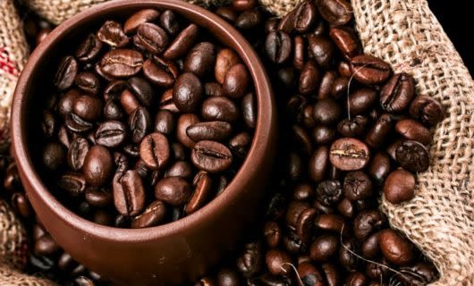 Close up of Colombian coffee beans in a brown bowl