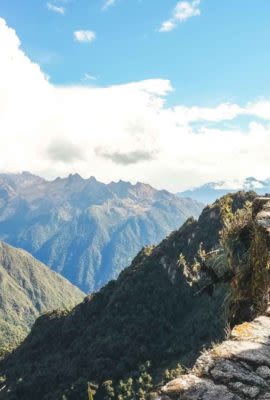 Person hiking cliffside section of Inca Trail