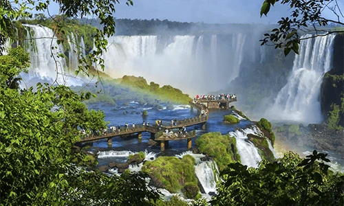 Tourists at Iguazu Falls, one of the world's great natural wonders, near the boarder of Argentina and Brazil