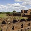 Ancient stone ruins with arched openings and partial walls, surrounded by green grass and trees under a partly cloudy sky—these scenes evoke the historic sites I learned about in Paraguay.