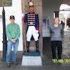 Two people stand on either side of a statue of a uniformed soldier at an outdoor location in mainland Ecuador. The date 01/08/2012 is visible in the bottom right corner, marking a memorable moment from their Ecuador travel trip report.