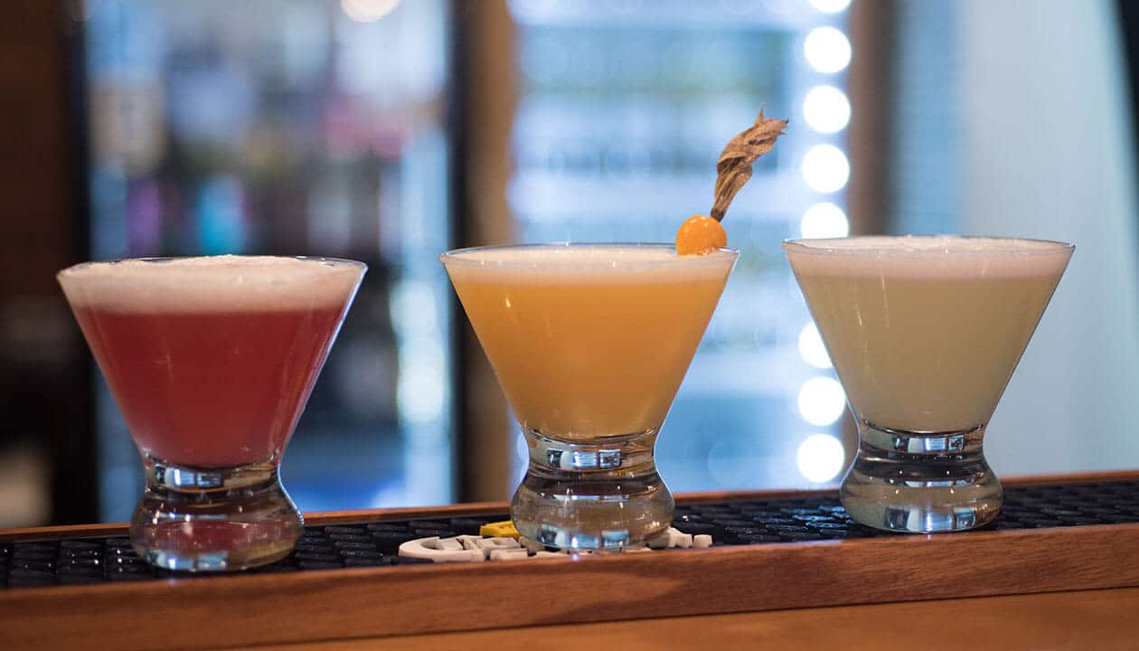 three different flavors of pisco sour cocktail