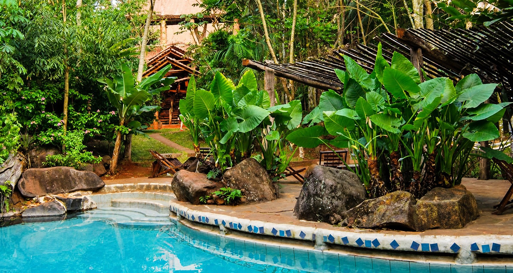 Pool surrounded by tropical plants at Yacutinga Lodge in the Misiones rainforest, Argentina