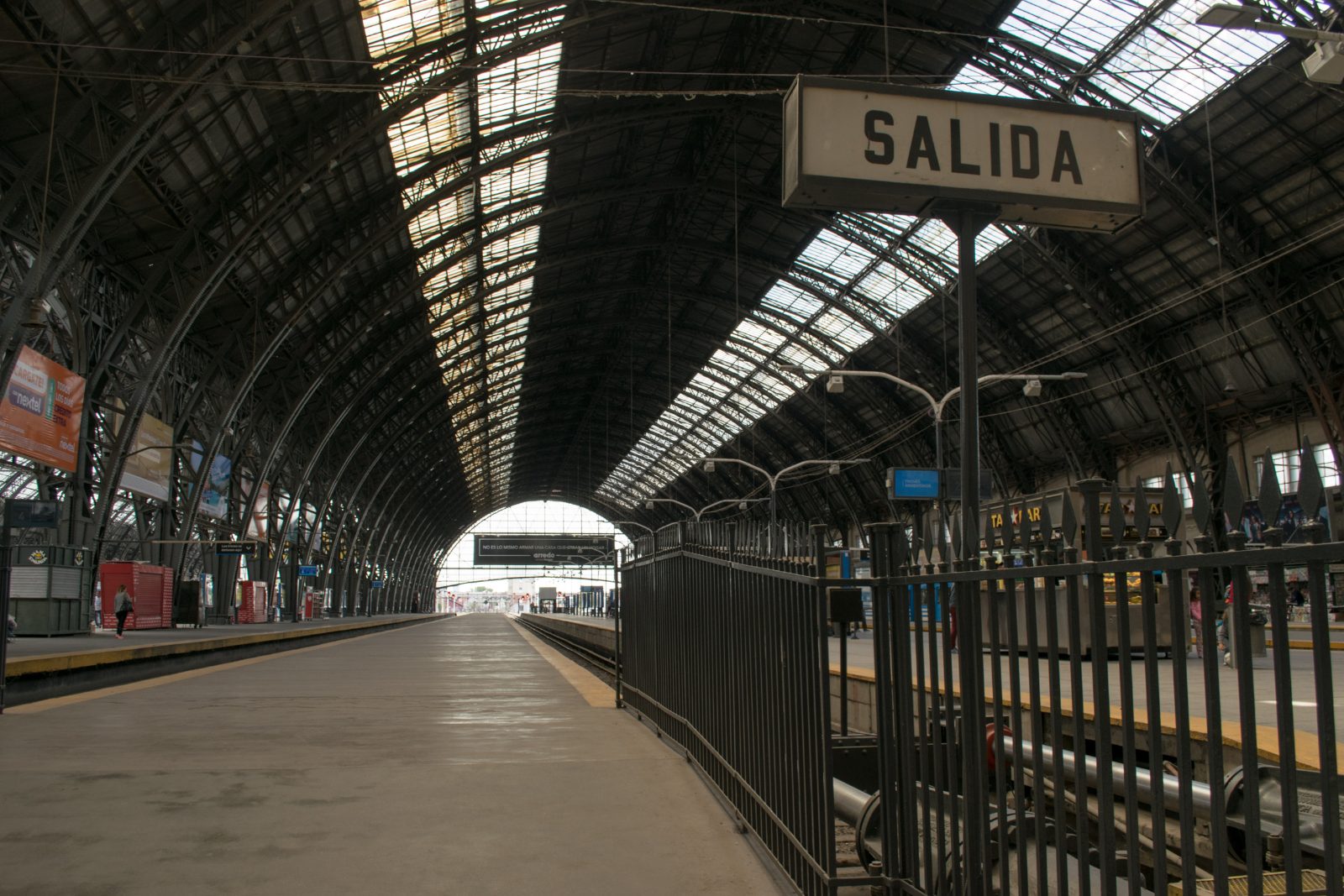 The iron and glass trainshed of Retiro railway station in Buenos Aires, seen along an empty platform