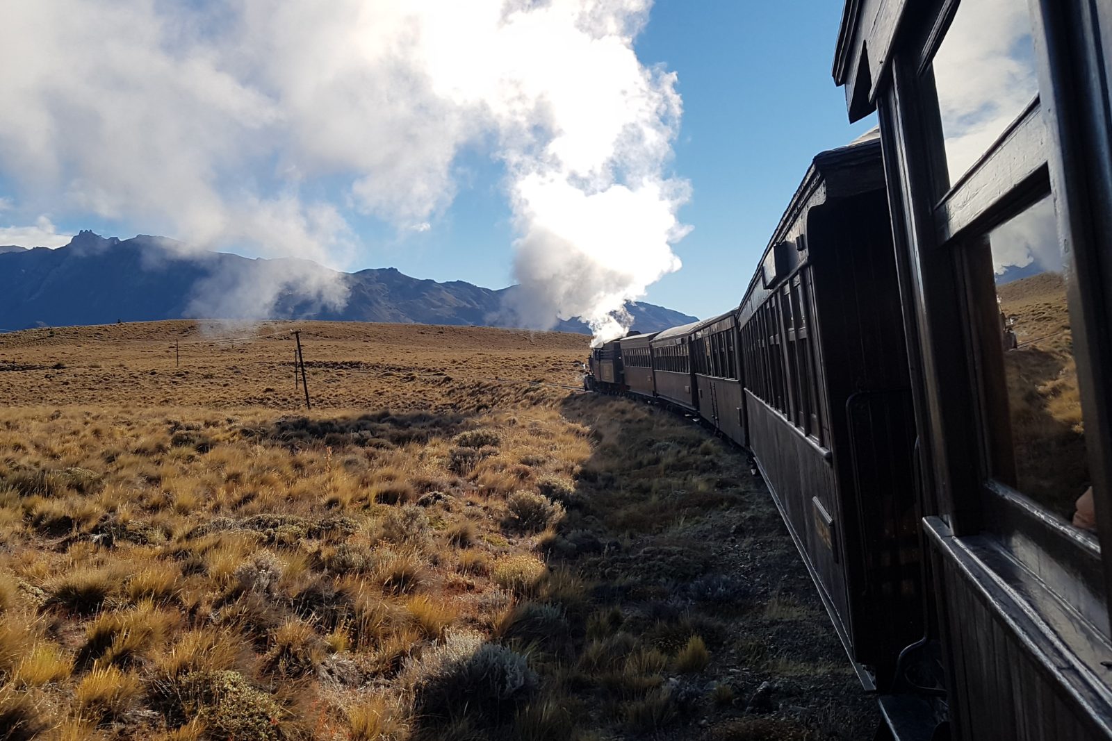The Old Patagonian Express steam train crossing the Patagonian steppe near Esquel, seen from the carriages