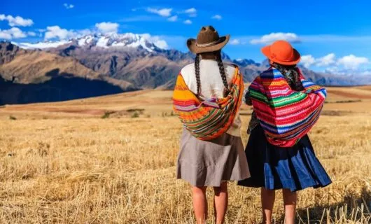 the-sacred-valley-of-the-incas-with-two-native-women-looking-at-view