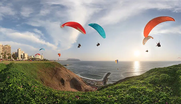 paragliding over lima peru at sunset