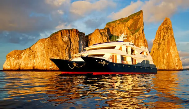 ocean spray galapagos cruise ship in front of the kicker rock