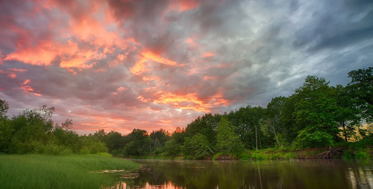 sunset over water in amazon