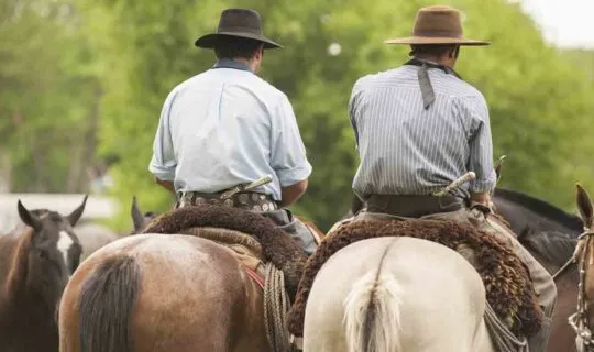 two-men-ridding-horses-in-argentina