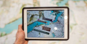 man holding tablet with map