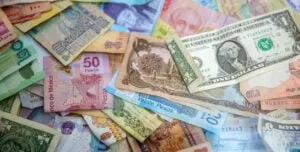 different currencies on pile