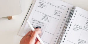 woman organizing her day on calendar