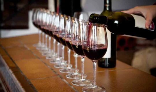 several-wine-glasses-being-filled-with-red-wine