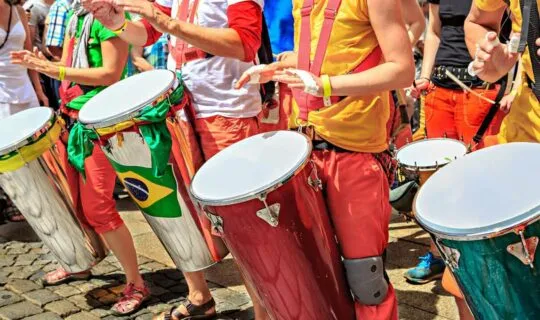 locals-dressed-in-colorful-clothes-and-drumming-during-parade