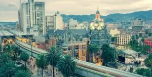 Medellin downtown cathedral and city light rail.