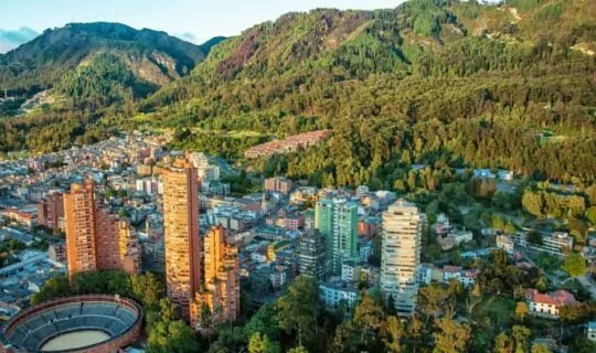 bogota-colombia-high-rises-just-before-steep-green-hill