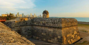 old fort and gun tower with Cartagena city at back
