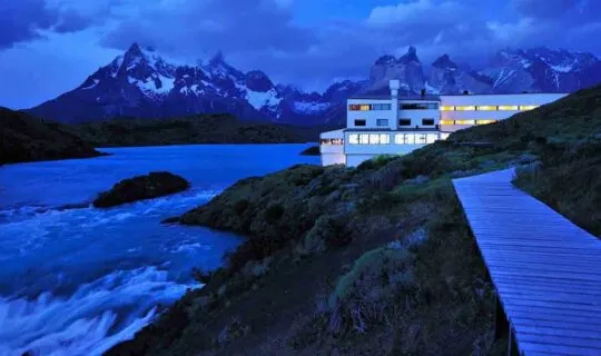 torres-del-paine-at-night-with-distant-mountains-and-lodge