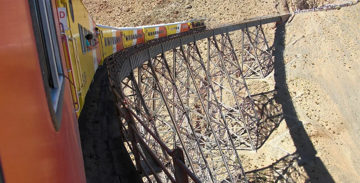 train atop raised tracks - train to the clouds