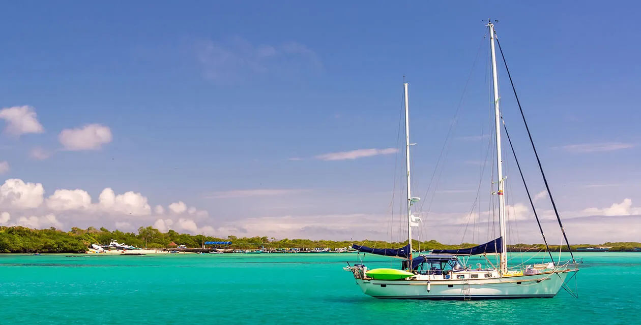 sail boat on blue waters of the Galapagos 