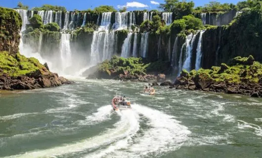Boats driving to the base of Iguazu Falls