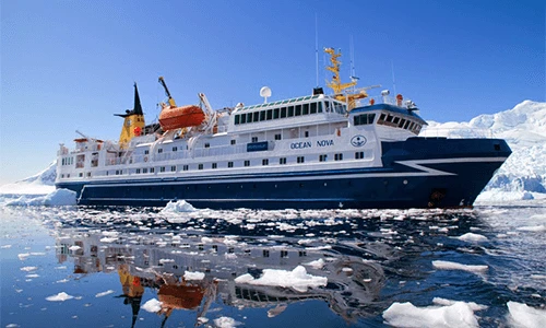 The cruise ship cruises through the icy water of Antarctica