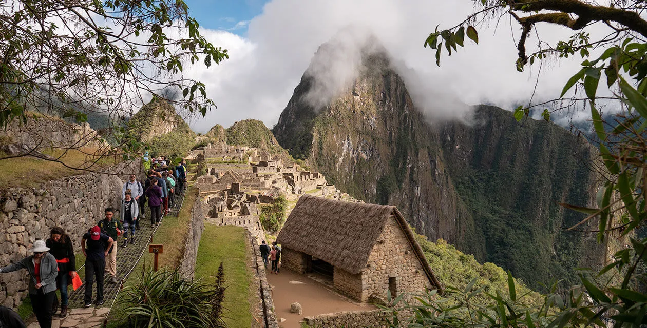 tourists walking around machu picchu