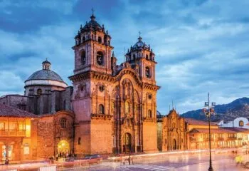 Sunset on the cathedrals in Cusco Peru's city square