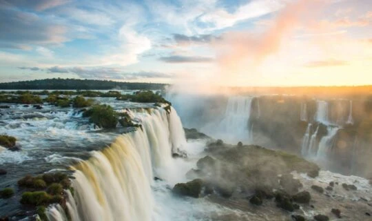 Iguazu Falls tour and view from above during beautiful sunrise