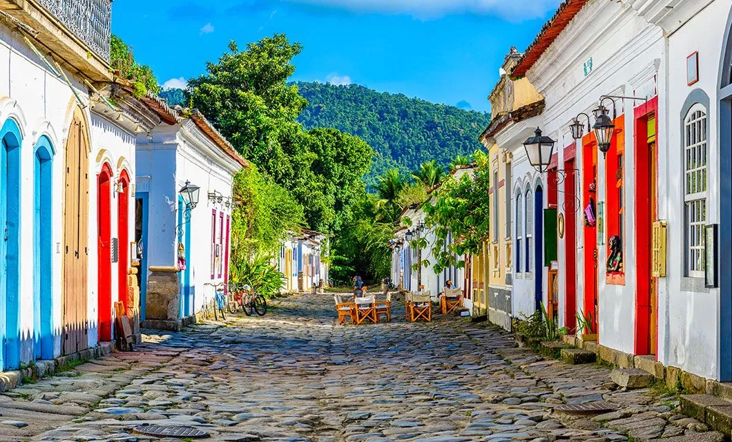 Historic road in Paraty with table and chairs