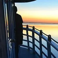 A man watching the sunset on Tucano deck