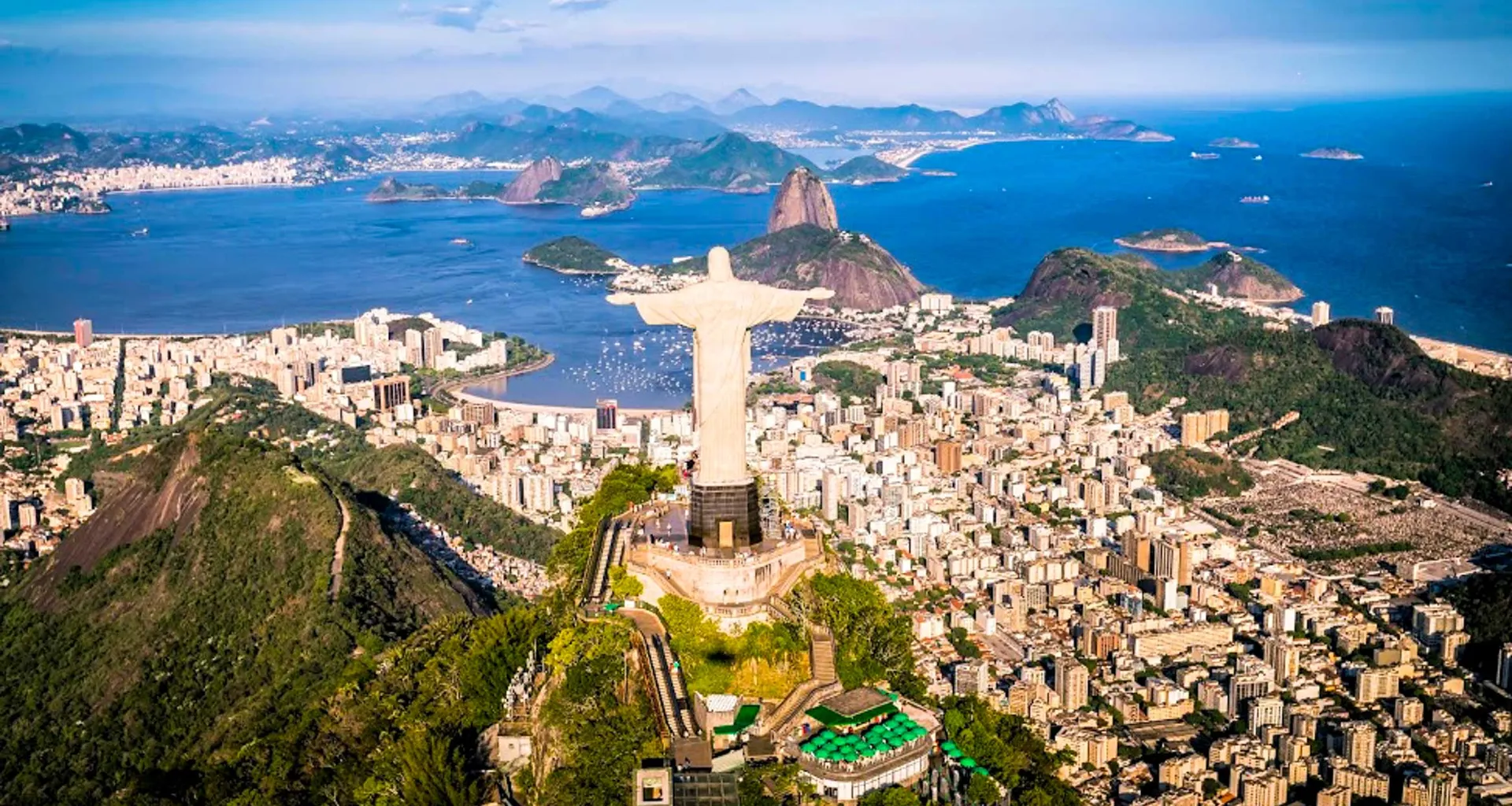 Aerial view of Rio de Janeiro past Christ the Redeemer statue