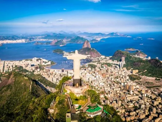 Aerial view of Rio de Janeiro past Christ the Redeemer statue