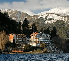 Exterior of mountain hotel with views of water