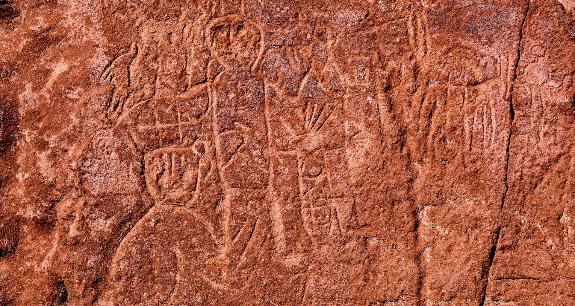 Markings and art on rock wall