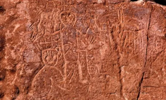 Markings and art on rock wall