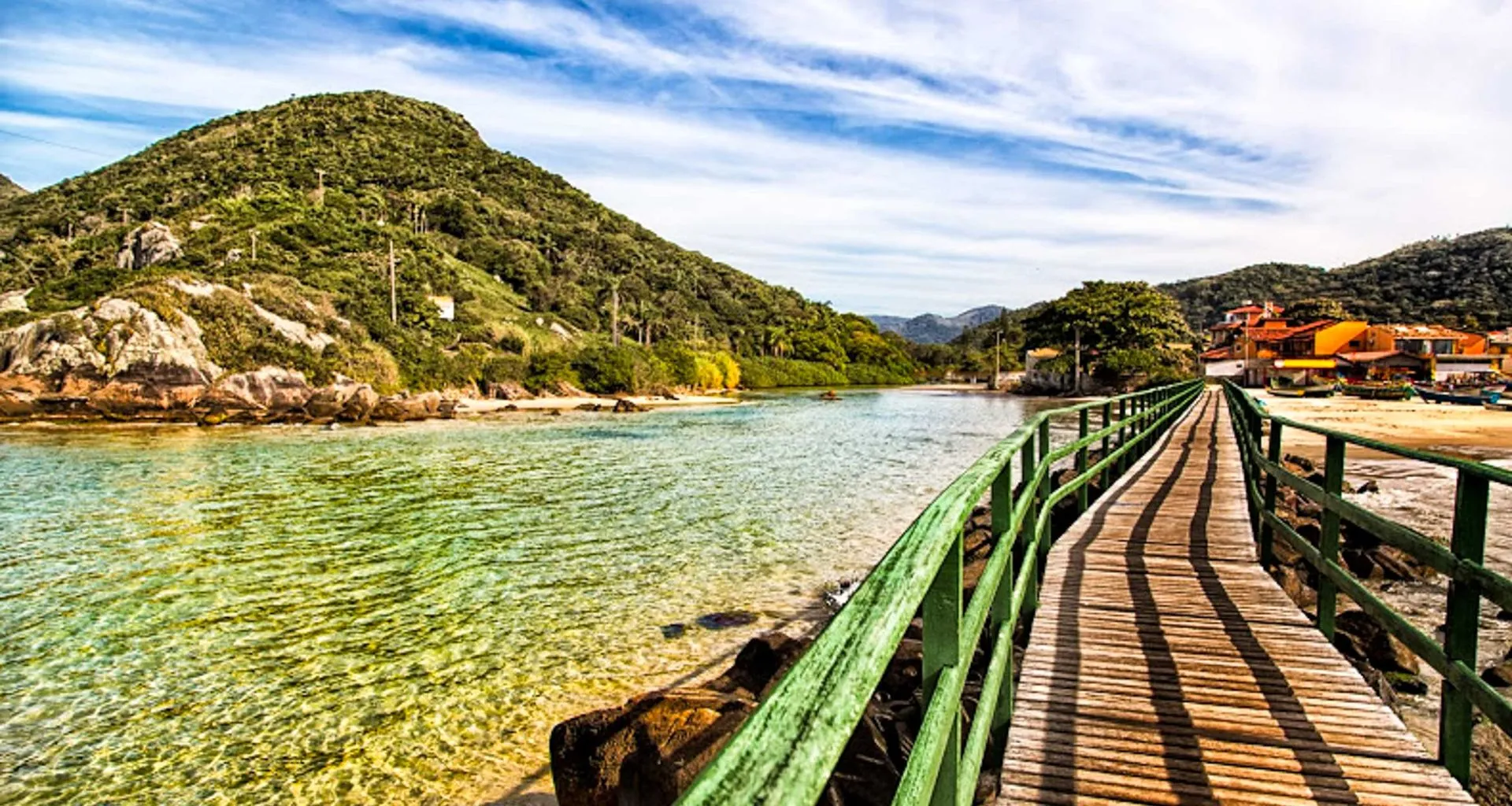 Walkway along beach near hill