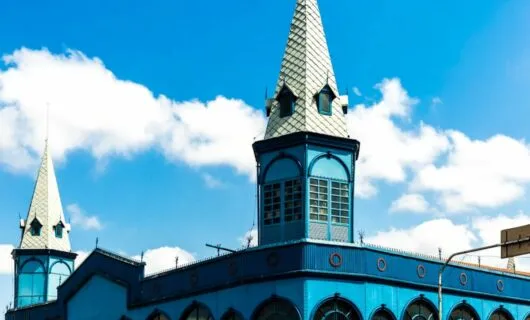 Spires of blue building against sky