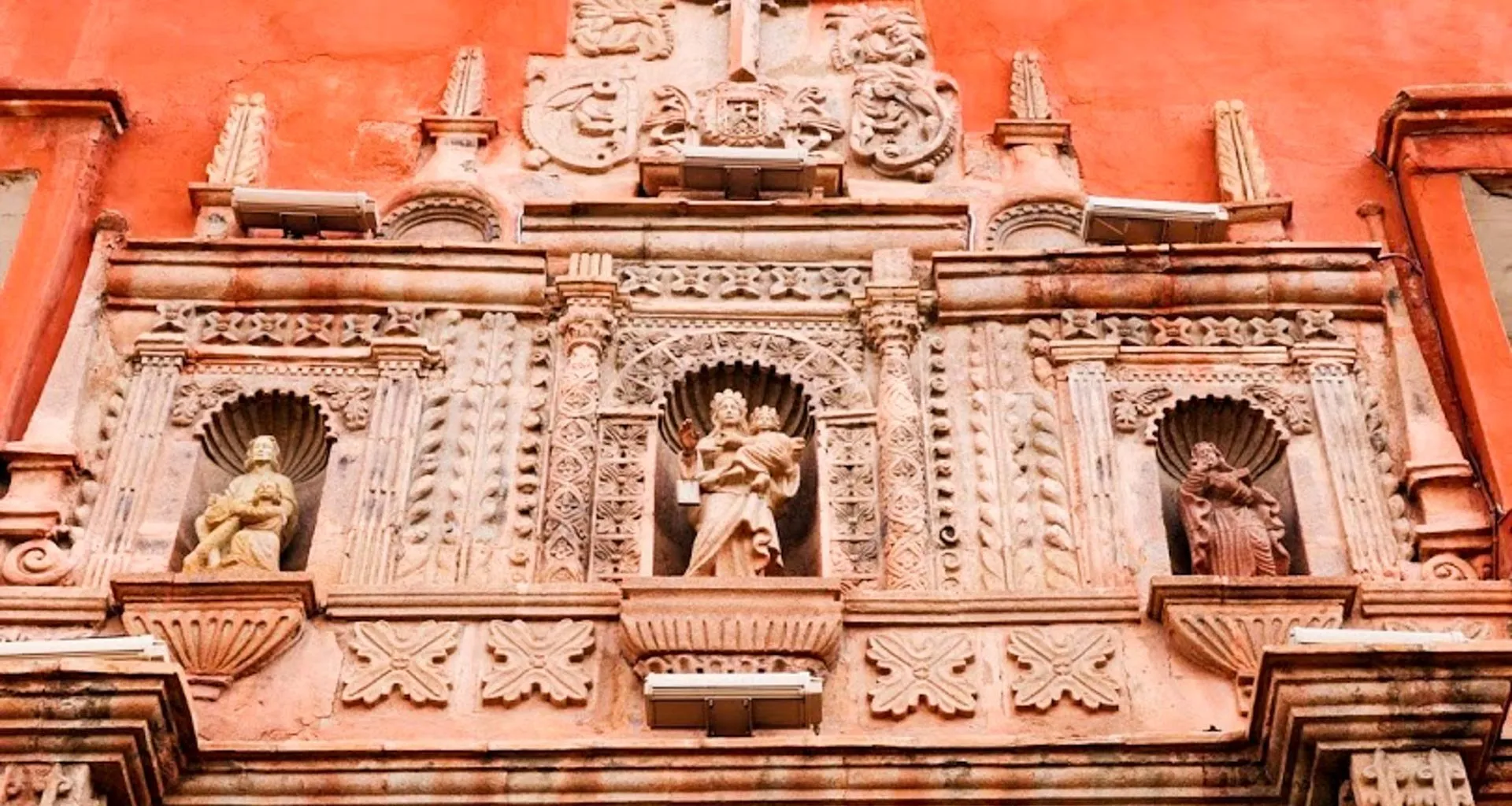 Statues on wall of Bolivia museum