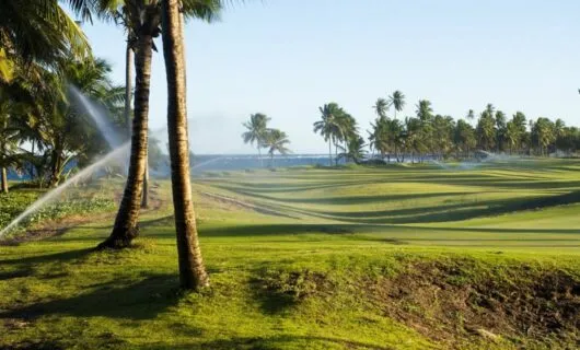 Sprinklers spray over Brazil golf green
