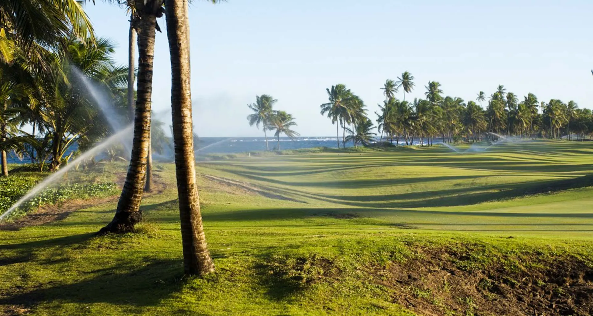 Sprinklers spray over Brazil golf green