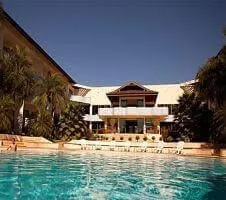 Palm tree shaded pool area