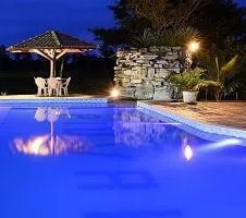 Pool and seating area at dusk